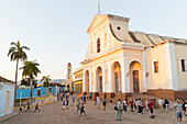 Iglesia Parroquial de la Santisima Trinidad at Plaza Mayor in the background the bell tower of Museo Nacional de la Lucha, formerly Iglesia y Convento de Sa, family travel to Cuba, parental leave, holiday, time-out, adventure, Trinidad, province Sancti Sp