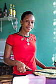 Beautiful Cuban woman working in a creperie restaurant near the terraces of Trinidad, family travel to Cuba, parental leave, holiday, time-out, adventure, Trinidad, province Sancti Spiritus, Cuba, Caribbean island