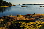 Sunrise with canoe, landscape Kallandsö at Lake Vättern, Sweden