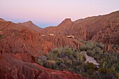 Rockformation in the Dadés gorge with casbah and poplar trees,  small road beside a river passing the gorge, High Atlas, Morocco