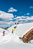 People on a snowshoe tour through a snowy landscape, Illertal, Hoernerdoerfer, Allgau, Baden-Wuerttemberg, Germany, Europe