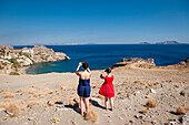Two girls taking photos on the beach, beach and coast near Agios Pavlos, Crete, Greece, Europe