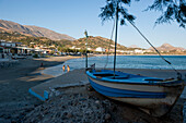 Boat on the beach at sunset, Plakias, Crete, Greece, Europe