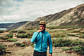 Man walking at the coast of greenland, Greenland, arctic.