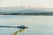 View of Lake Constance with excursion boat, in the back the Swiss Alps with Säntis, near Meersburg, Baden-Württemberg, Germany