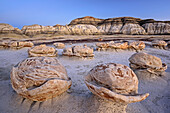 Striped rock eggs with sandstone at dawn, Bisti Badlands, De-Nah-Zin Wilderness Area, New Mexico, USA