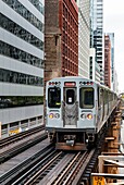 SA, IL, Chicago. Train on the elevated tracks in 'The Loop' section of the transit system. Also known as the L Train.