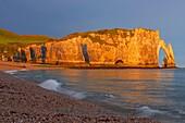 Etretat, Aval cliff , Falaise d'Aval, Natural Arch and Stone Beach, Normandy, Dawn, Seine Maritime, Upper Normandy, Haute Normandie, France.