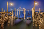 Europe, Italy, Veneto, Venice. Night landscape towards the island of San Giorgio with the gondolas.