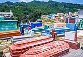 Colorful Cemetery in Chichicastenango Guatemala. in Guatemala family members paint the tombstone as a way of honoring the dead.