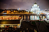 RUSSIA, Moscow. RUSSIA, Moscow. Night view of Bar Strelka and the Cathedral of Christ the Saviour located by the Moscow River.