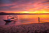 INDONESIA, Flores, Riung, sunset reflecs off of the Flores Sea, Rutong island