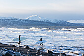 Surfers Entering Kachemak Bay Along Homer Spit, Southcentral Alaska, USA