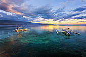 Sunset Over The Ocean With Pump Boats; Moalboal, Cebu, Central Visayas, Philippines