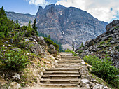 Steps leading up a towards a rugged mountain on a mountain trail in Banff National Park; Alberta, Canada