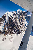 Aerial view of the steep NW face of Mt. Hayes, the tallest mountain in the eastern half of the Alaska Range; Alaska, United States of America
