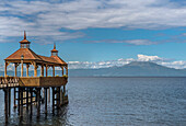 Pavilion at end of pier at Llanquihue Lake with view of volcano Osorno, Frutillar, Llanquihue province, Chile
