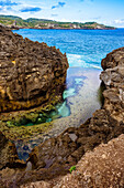 Rocky ocean coastline during sunny weather, Bali, Indonesia