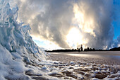 Wave crashing on beach at dawn, north shore of Oahu, Hawaii Islands, USA