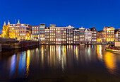 Amsterdam, Netherlands, Cityscape with lights on, reflecting on a canal at night