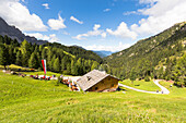 a view of the Kaserill Alm with the Geisler Gropu in the background, Villnössertal, South Tyrol, Trentino Alto Adige, Italy