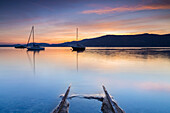 Emerged boat rails at Sasso Moro dock during an autumnal sunset, Sasso Moro, Leggiuno, Lake Maggiore, Varese Province, Lombardy, Italy.