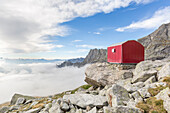 Lombardy, Italy, the Molteni biwak in Ferro valley clouds above, Masino valley