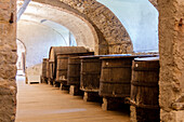 Wood barrels of wine cellar of the monastery of Astino, Longuelo, province of Bergamo, Lombardy, Italy, Europe