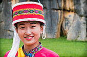Sani minority girl with traditional dress at Stone Forest or Shilin, Kunming, Yunnan Province, China, Asia, Asian, East Asia, Far East