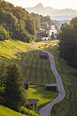 The iconic Wamberg Church, with Mount Alpspitze and Zugspitze on the background, Wamberg, Garmisch Partenkirchen, Bayern, Germany