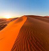 Sunrise over Sossusvlei sand dunes, Namib Desert, Namibia, Africa