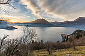 Italy, Lombardy, the sunset of Como lake, at bottom right Varenna village, in the background Crocione mountain