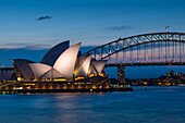 Sydney Opera House, UNESCO World Heritage Site, and Harbour Bridge after sunset, Sydney, New South Wales, Australia, Pacific
