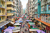 A busy market street in Mong Kok (Mongkok), Kowloon, Hong Kong, China, Asia
