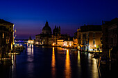 Buildings along canal at night, Venice, Italy