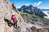 Sesto/Sexten, Dolomites, South Tyrol, province of Bolzano, Italy. Climber on the via ferrata De Luca-Innerkofler to the summit of Monte Paterno.