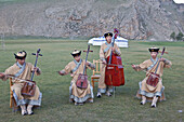 Local band play Mongolia's National instrument, the Morin khuur (horse head fiddle) and perform Khoomi, throat singing, Bunkhan, Mongolia, Central Asia, Asia