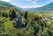Panoramic of medieval Abbey of San Pietro in Vallate from drone, Piagno, Sondrio province, Lower Valtellina, Lombardy, Italy, Europe