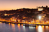 View over Douro River at sunset to Ribeira District, UNESCO World Heritage Site, Porto (Oporto), Portugal, Europe
