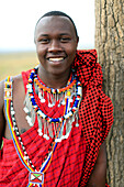 Portrait of a Masai man wearing colorful traditional clothes, Masai Mara Game Reserve, Kenya, East Africa, Africa