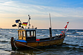 Small wooden fishing boat on the beach of Ahlbeck, Usedom, Ostseeküste, Mecklenburg-Western Pomerania, Germany