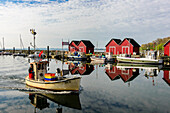 Swedish boat houses in the harbor of Boltenhagen, Baltic Sea coast, Mecklenburg-Western Pomerania, Germany