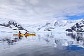 Kayakers in spectacular mountain and glacial scenery, reflections of Neko Harbour, Anvord Bay, Antarctic Continent, Antarctica, Polar Regions