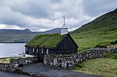 The wooden turf roofed church in Funningur, Eysturoy Island, Faroe islands, Denmark, Europe