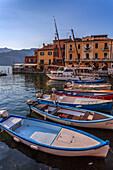 View of boats in Malcesine Harbour by the Lake, Malcesine, Lake Garda, Veneto, Italian Lakes, Italy, Europe