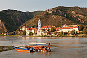 View over Danube River to Collegiate church and castle ruins, Durnstein, Wachau, Lower Austria, Austria, Europe
