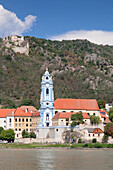 View over Danube River to Collegiate church and castle ruins, Durnstein, Wachau, Lower Austria, Europe