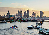View over River Thames towards City of London at sunrise, London, England, United Kingdom, Europe