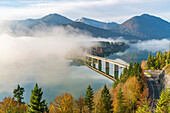 Sylvenstein Lake and bridge surrounded by the morning mist, Bad Tolz-Wolfratshausen district, Bavaria, Germany, Europe