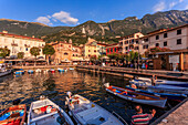 View of boats in Malcesine Harbour by the Lake, Malcesine, Lake Garda, Veneto, Italian Lakes, Italy, Europe